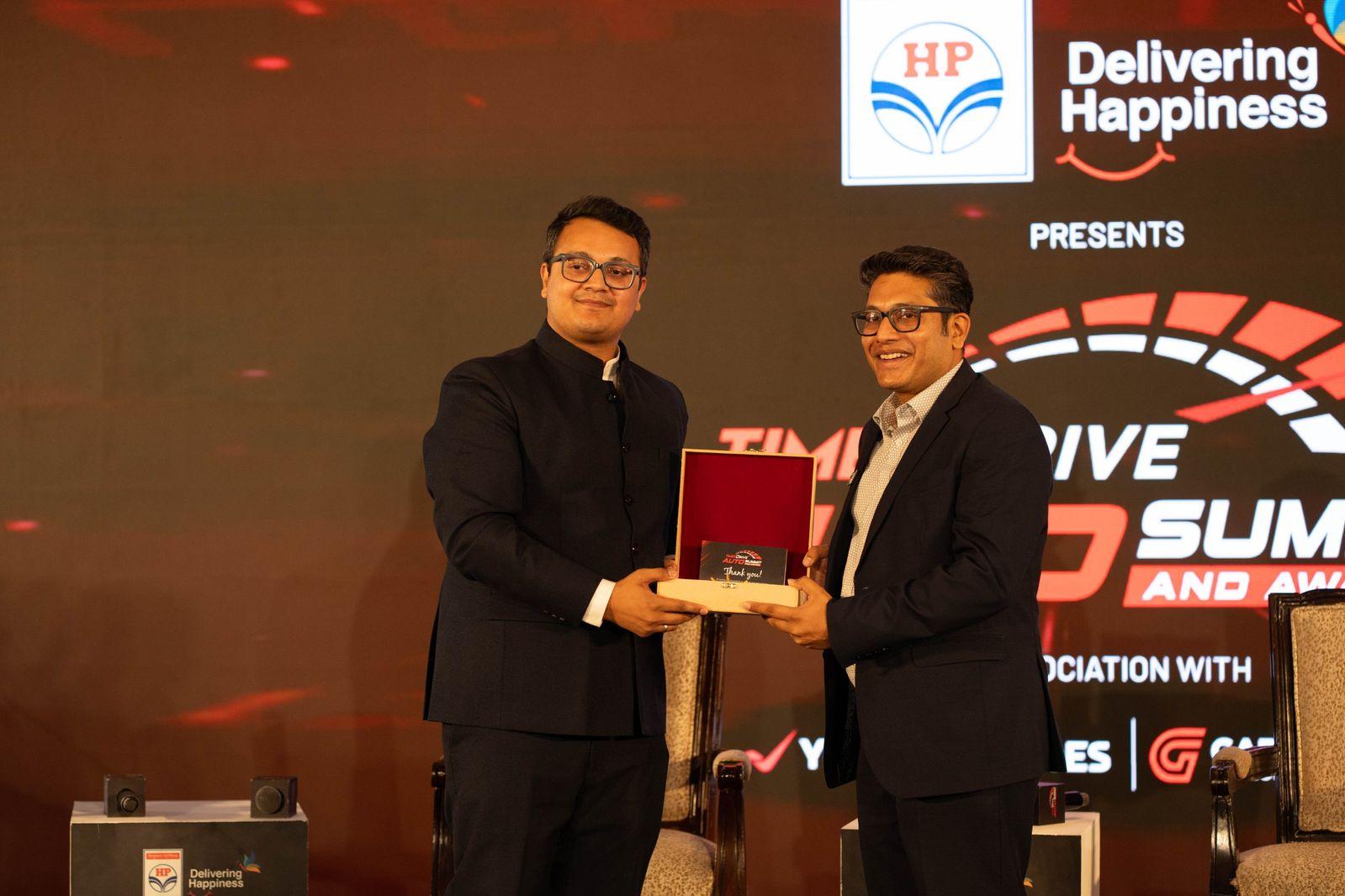 Naveen Gupta receiving a memento from Times Drive
